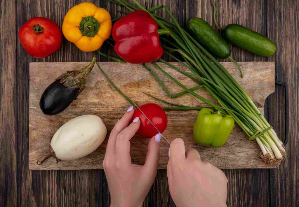 Dice the tomatoes and slice the onion. Cut the jalapeños